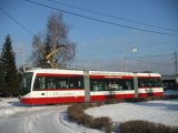 Inekon Tram on the snowy Street in Ostrava
