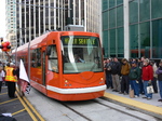 Inekon streetcar and Grand Opening Day crowd at Westlake Hub